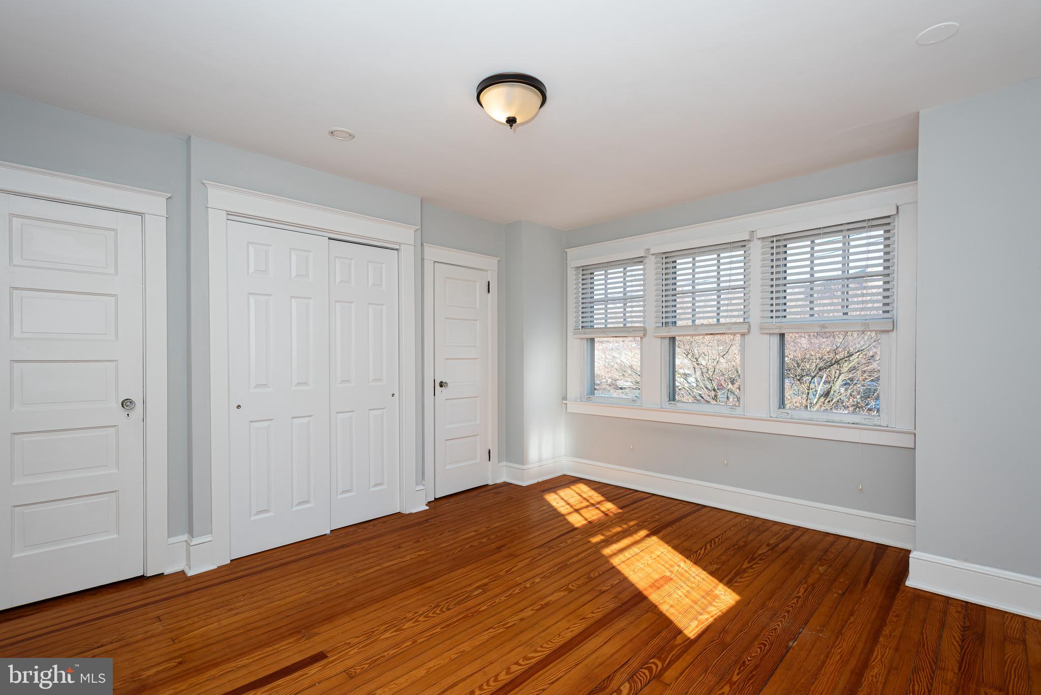 112 Conestoga Road Wayne, PA 19087 - Photo 21 of 32 a view of a room with wooden floor and window