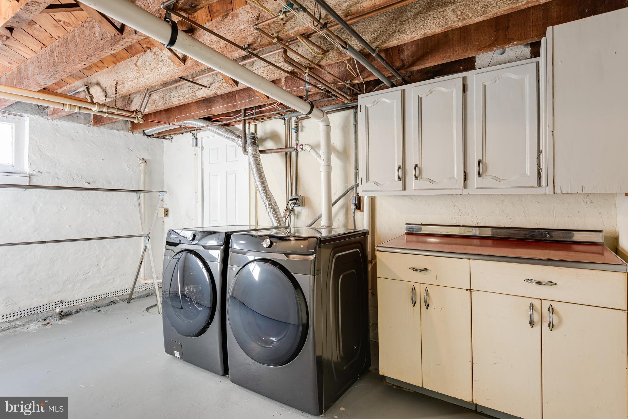 112 Conestoga Road Wayne, PA 19087 - Photo 27 of 32 a utility room with dryer and washer