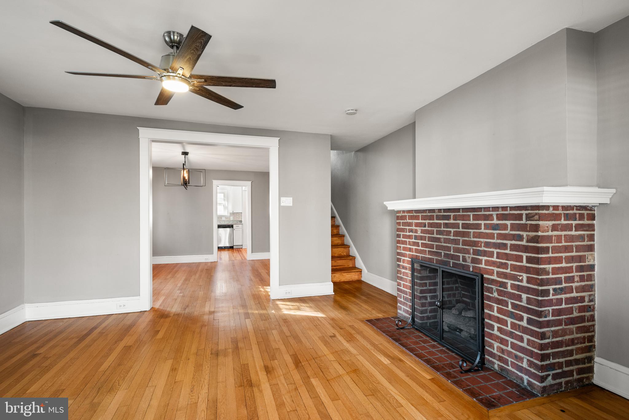 112 Conestoga Road Wayne, PA 19087 - Photo 7 of 32 a view of an empty room with wooden floor and a fireplace