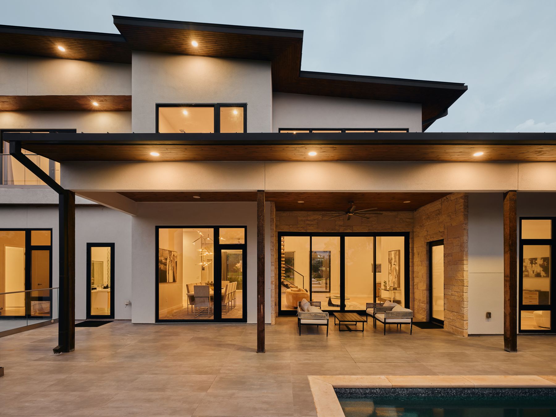 2476 Waymaker Way Austin, TX 78746 - Photo 24 of 31 A modern architectural marvel showcasing sleek lines and illuminated outdoor living spaces.