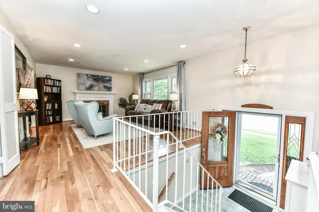 a view of a living room and a livingroom with furniture wooden floor