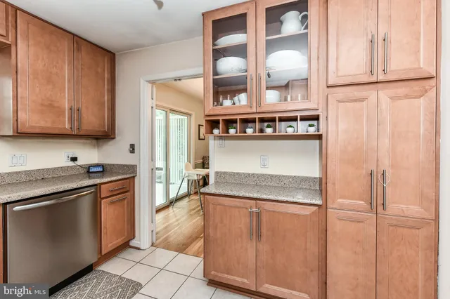 a kitchen with stainless steel appliances granite countertop a refrigerator and a stove