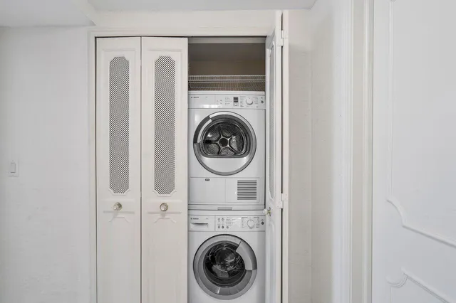 a balcony with trees in front of it