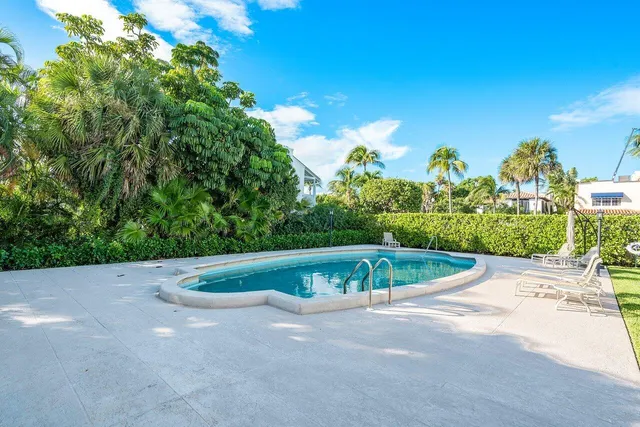 a view of a balcony with chairs and a table