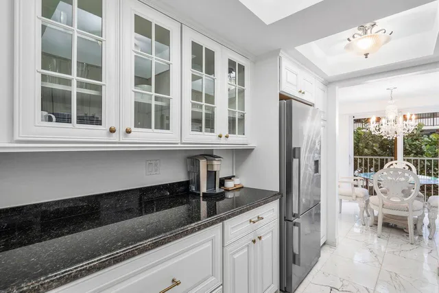 a kitchen with a sink and a refrigerator
