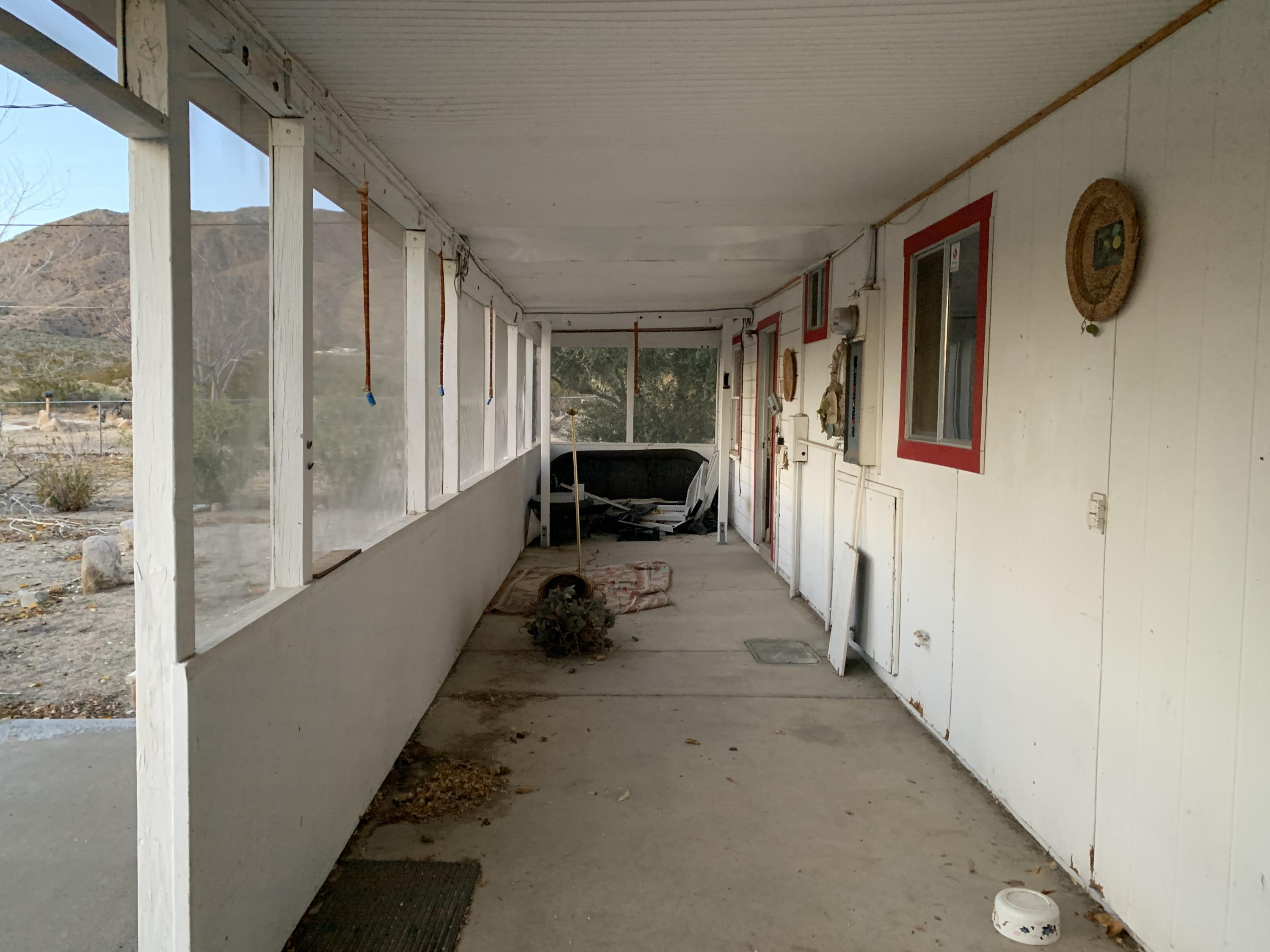 52781 Northridge Road Morongo Valley, CA 92256 - Photo 16 of 22 a hallway with windows