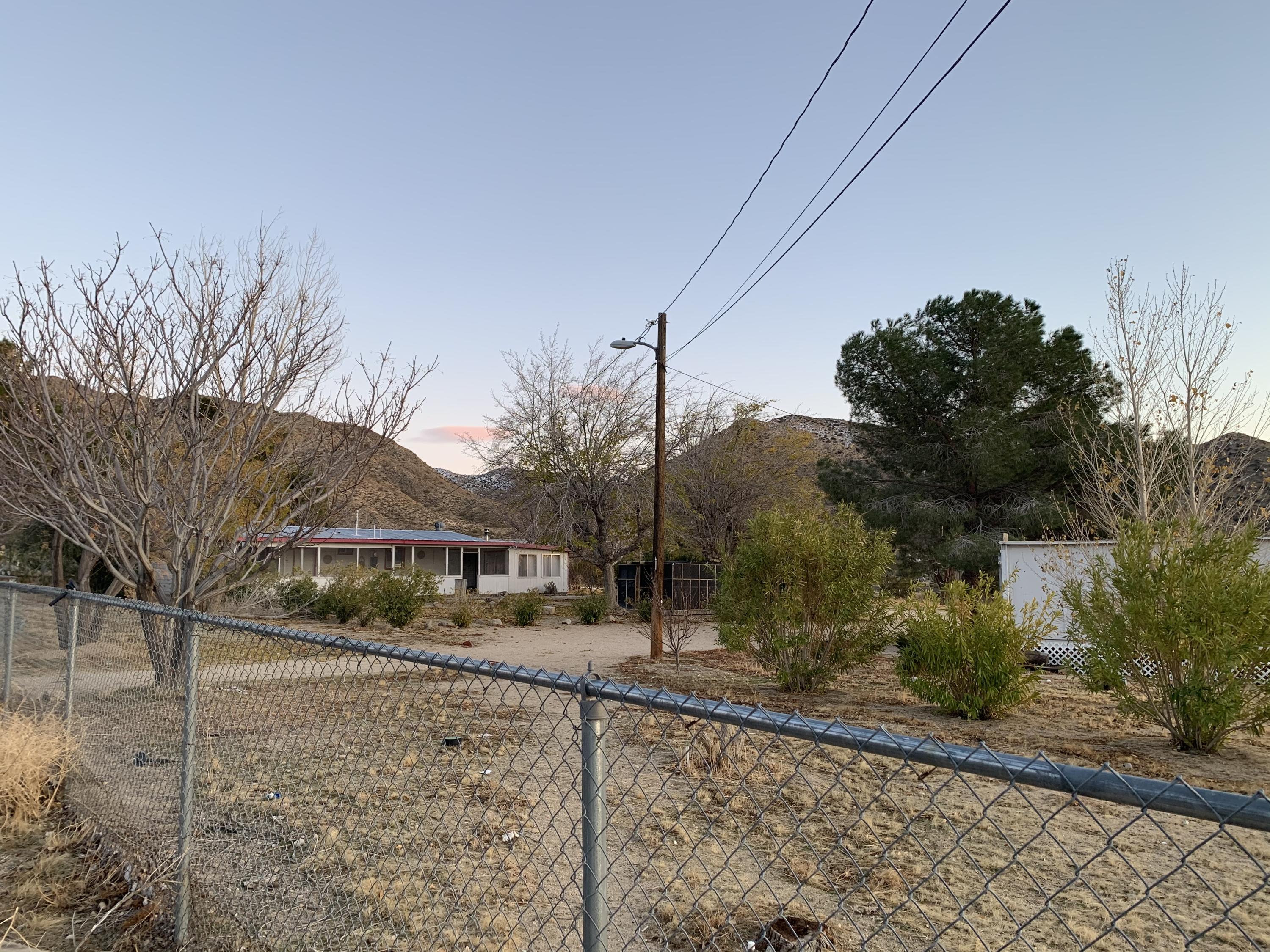 52781 Northridge Road Morongo Valley, CA 92256 - Photo 3 of 22 a view of a house with a snow on the road