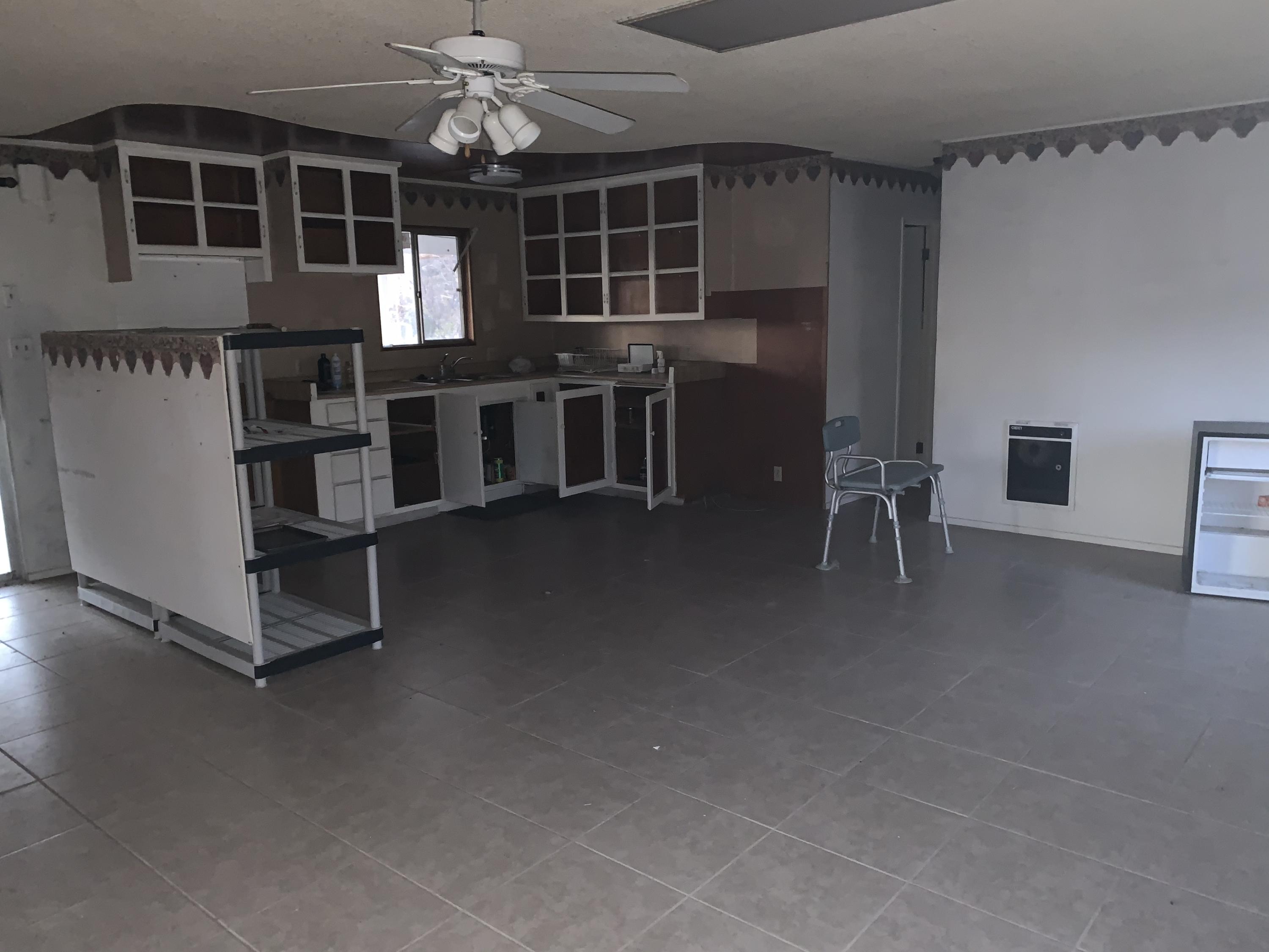 52781 Northridge Road Morongo Valley, CA 92256 - Photo 21 of 22 an open kitchen with cabinets and outdoor seating