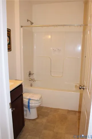 a bathroom with a toilet sink and shower