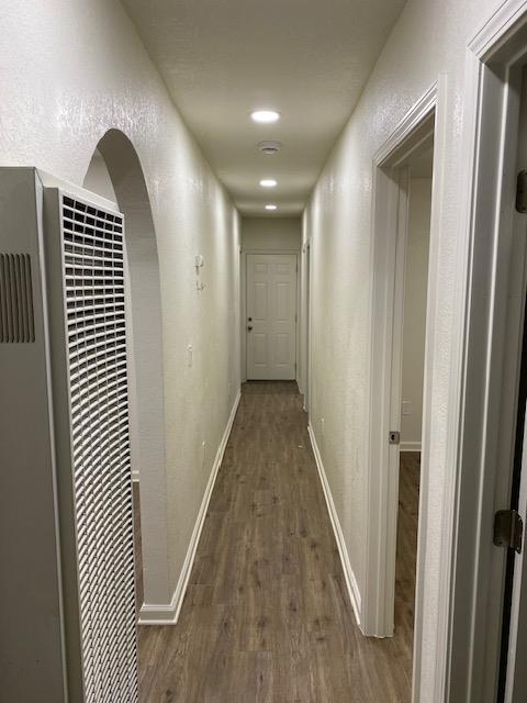 15792 Raymond Road Madera, CA 93638 - Photo 4 of 18 a view of a hallway with wooden floor and staircase