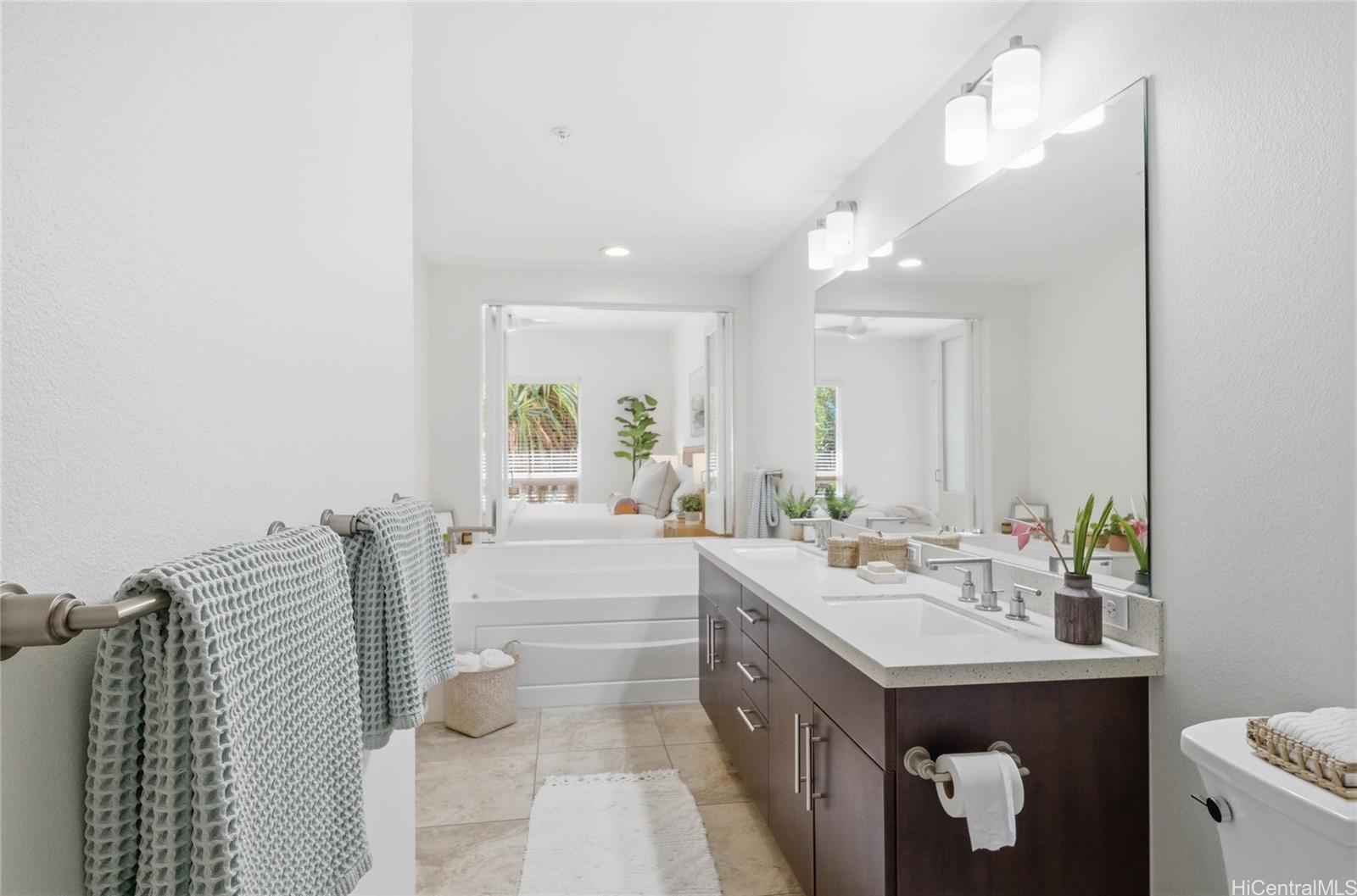 471 Kailua Road, Unit 3106 Kailua, HI 96734 - Photo 18 of 25 Spacious primary bathroom with dual vanity, bathtub and walk-on shower