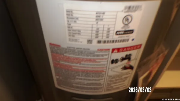 a view of a hallway with wooden floor and closet area