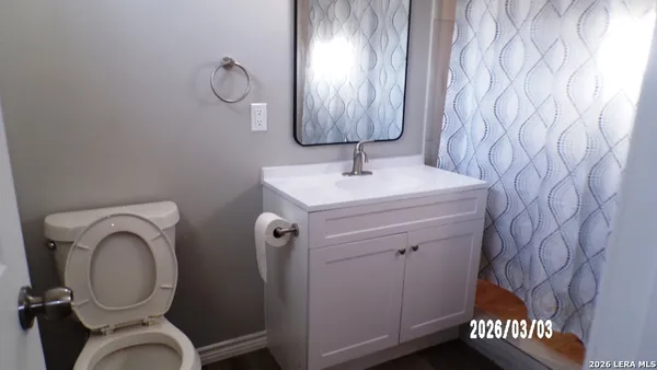 a view of a hallway with stairs