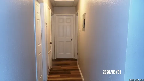 a white toilet sitting next to a shower