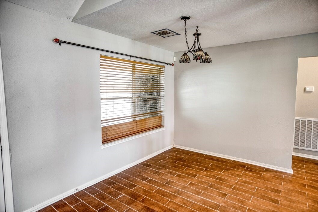 308 County Road 893B Angleton, TX 77515 - Photo 18 of 41 a view of empty room with wooden floor and fan