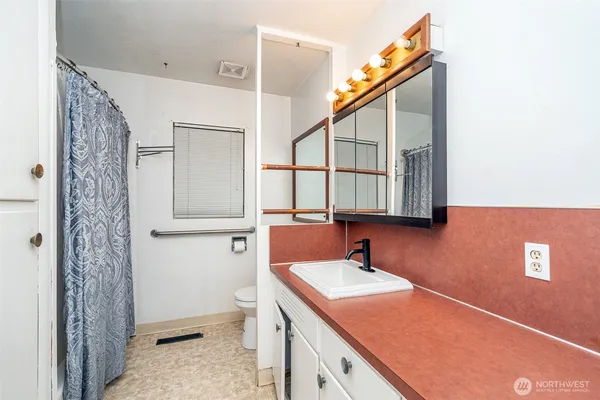 a bathroom with a sink and a mirror