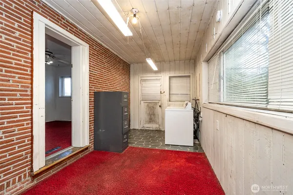 a view of a hallway with closet and entryway