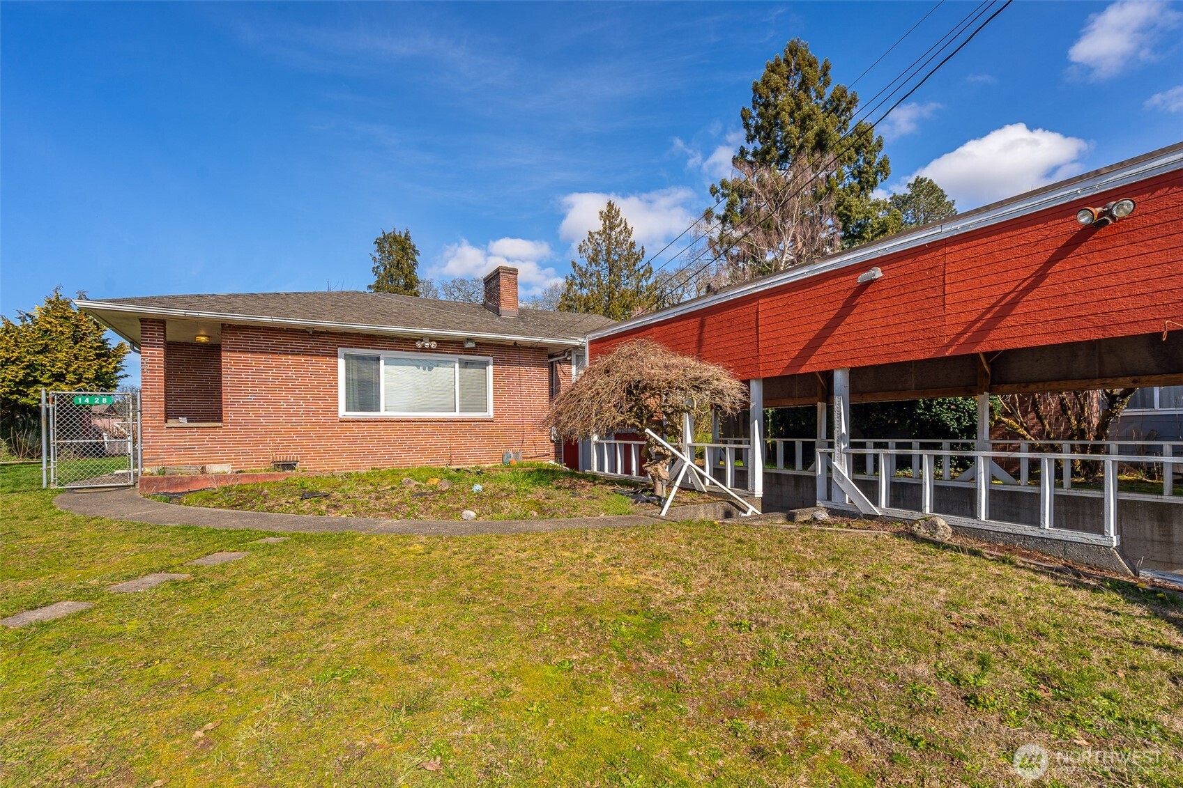 1428 Southwest Grandview Avenue Chehalis, WA 98532 - Photo 2 of 40 a view of a house with pool and sitting area
