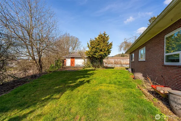 a view of house with yard