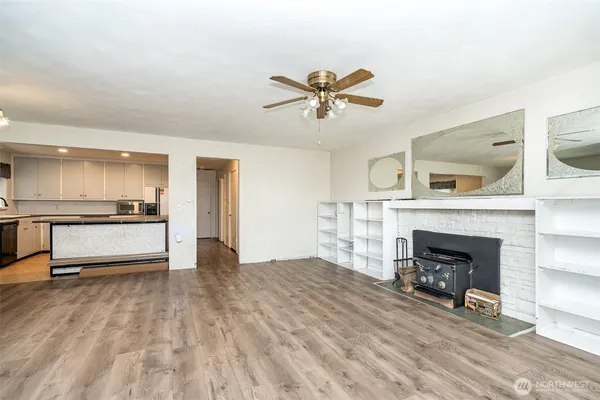 a view of an empty room with a fireplace