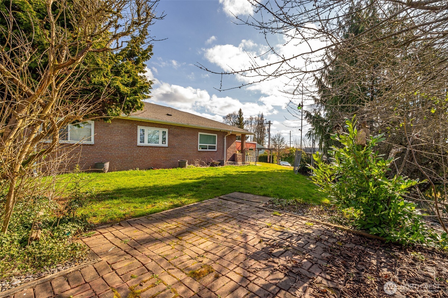 1428 Southwest Grandview Avenue Chehalis, WA 98532 - Photo 32 of 40 a view of a brick house with a yard