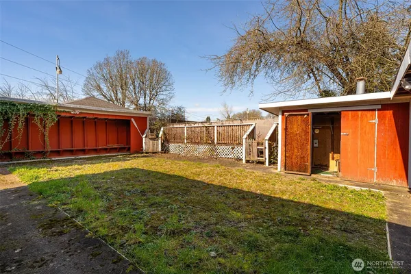 a view of a house with a yard and sitting area