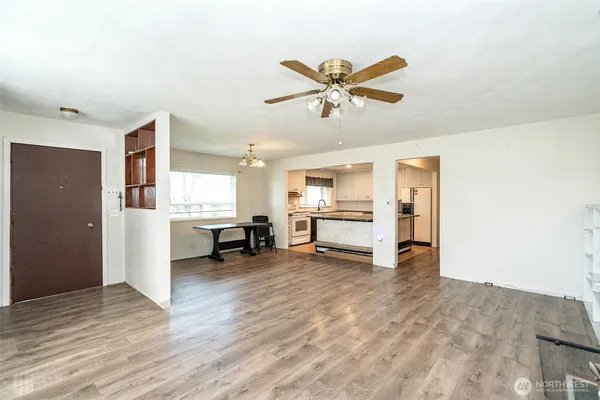 a view of a livingroom with a kitchen