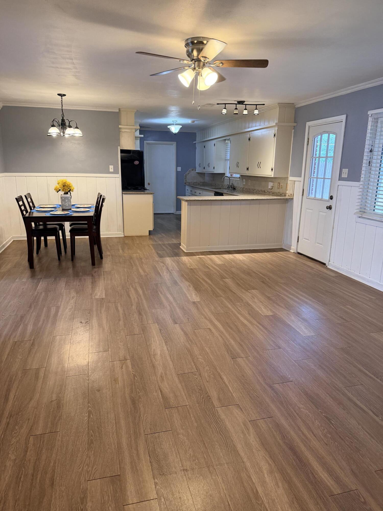 3814 27th Street Lubbock, TX 79410 - Photo 6 of 24 a view of a kitchen with a sink and a stove top oven
