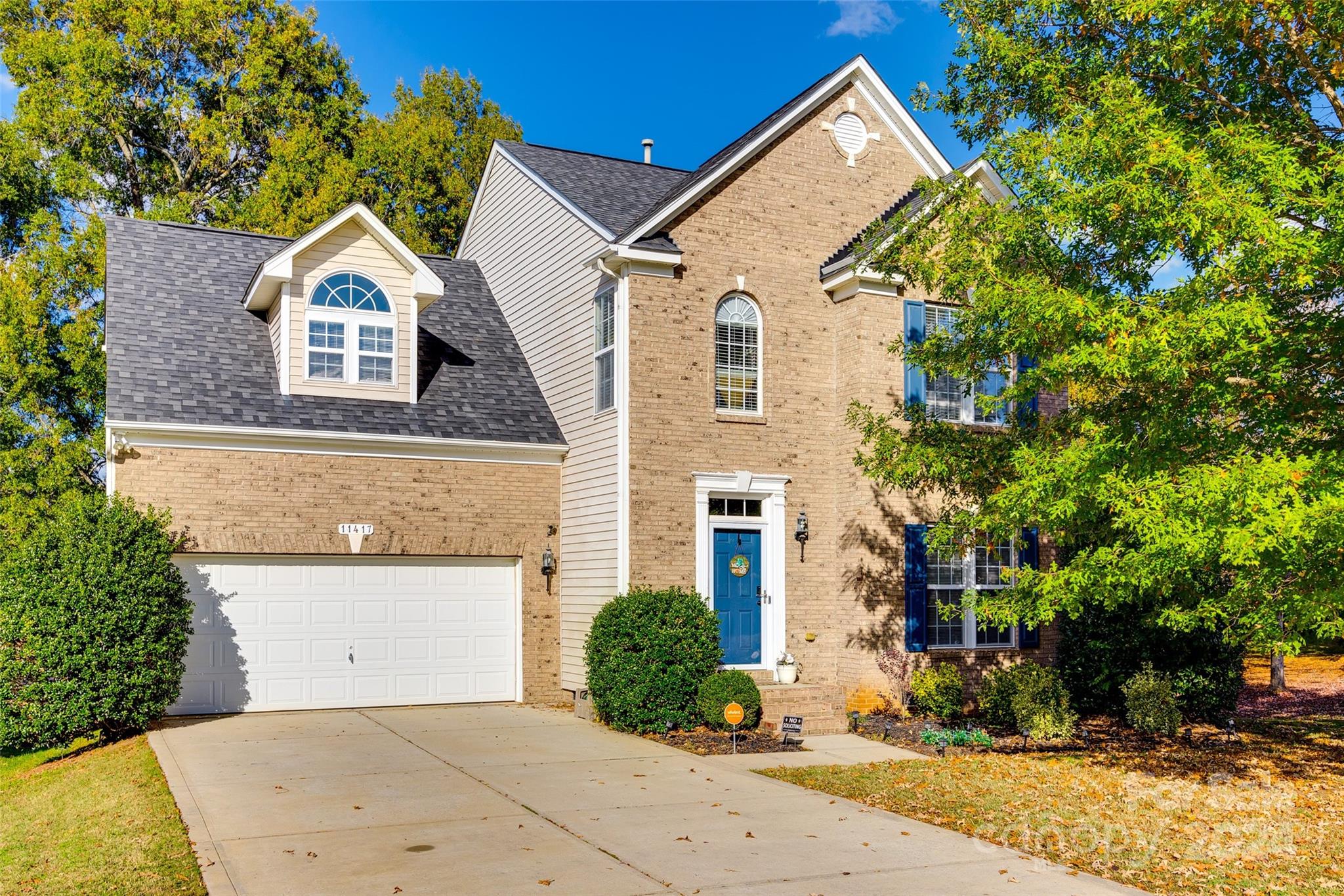 front view of a house with a yard