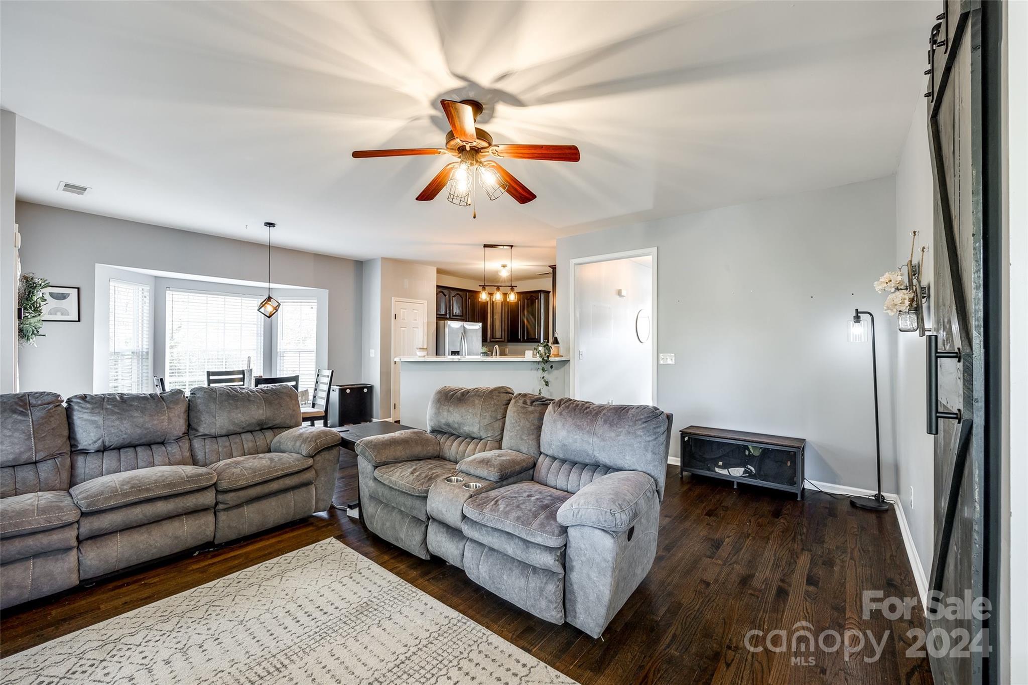 11417 Winget Pond Road Charlotte, NC 28278 - Photo 15 of 39 a living room with furniture and a wooden floor