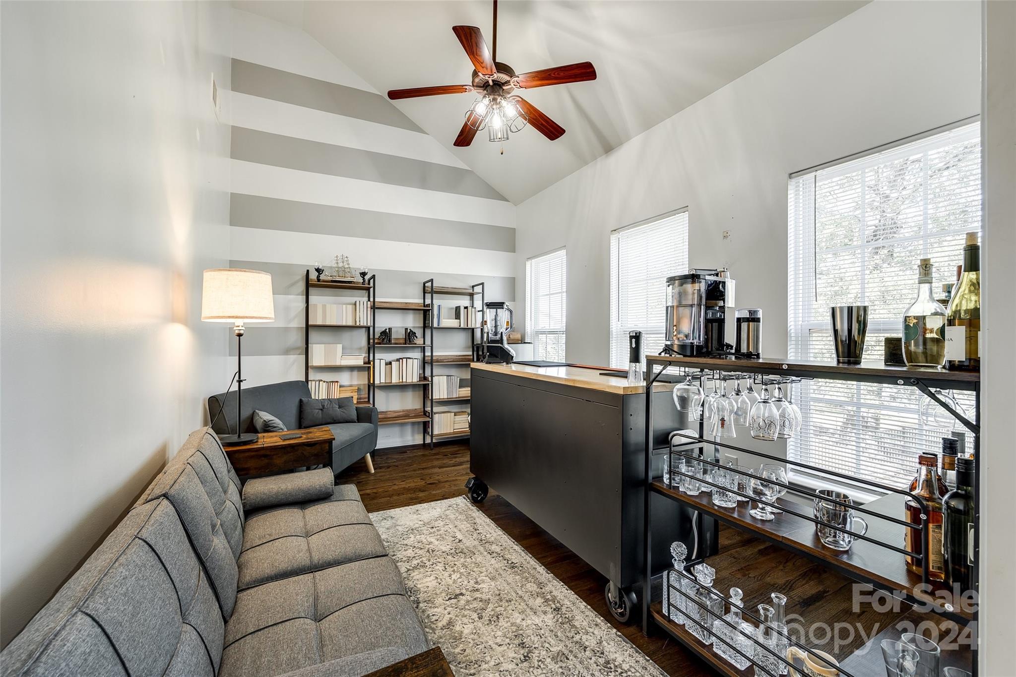 11417 Winget Pond Road Charlotte, NC 28278 - Photo 16 of 39 a living room with furniture a ceiling fan and a rug