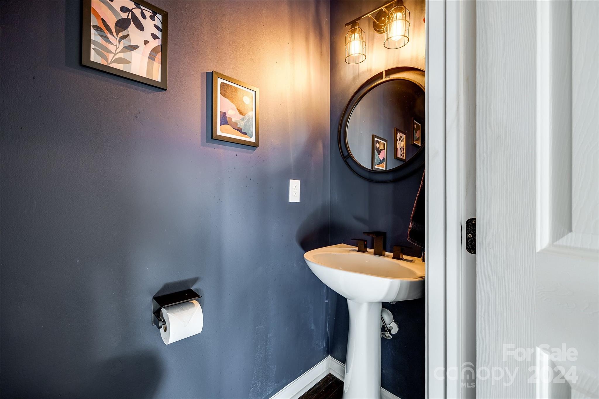 11417 Winget Pond Road Charlotte, NC 28278 - Photo 18 of 39 a bathroom with a toilet and a sink