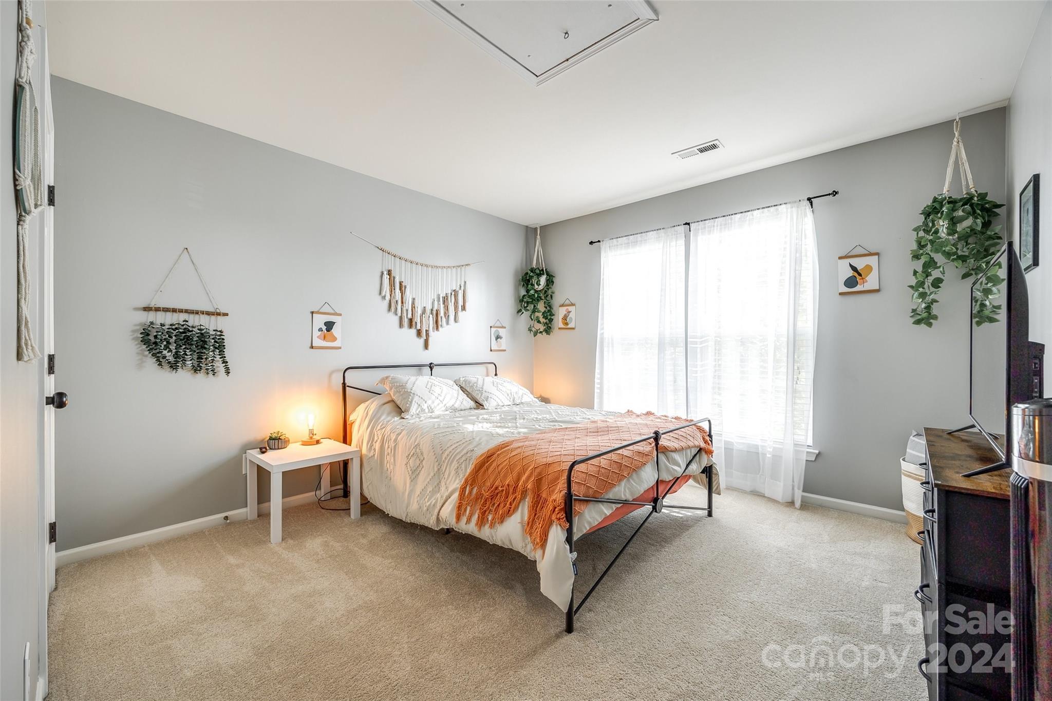 11417 Winget Pond Road Charlotte, NC 28278 - Photo 19 of 39 a bedroom with a bed chair and window
