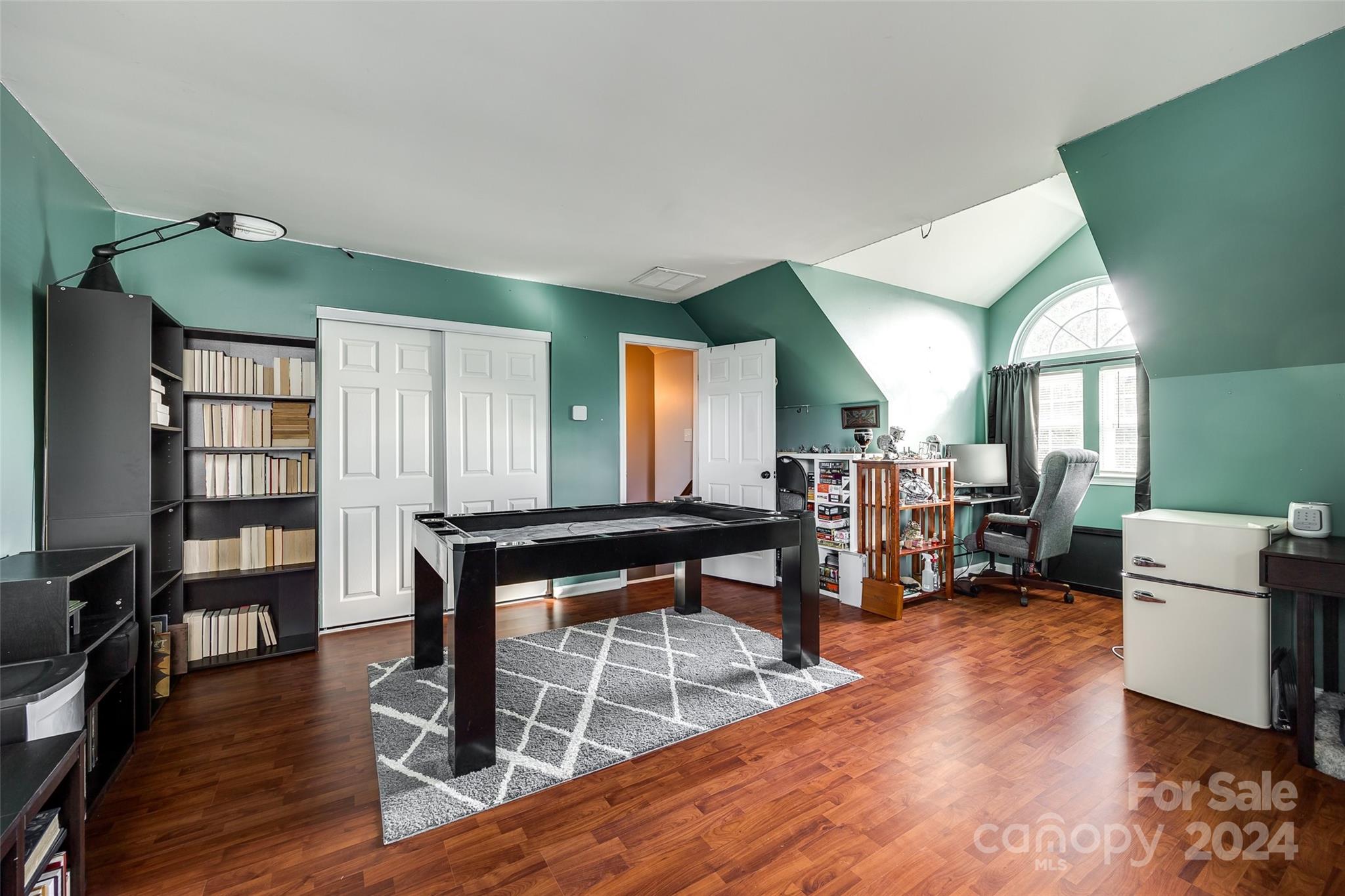 11417 Winget Pond Road Charlotte, NC 28278 - Photo 31 of 39 a room with furniture and a wooden floor