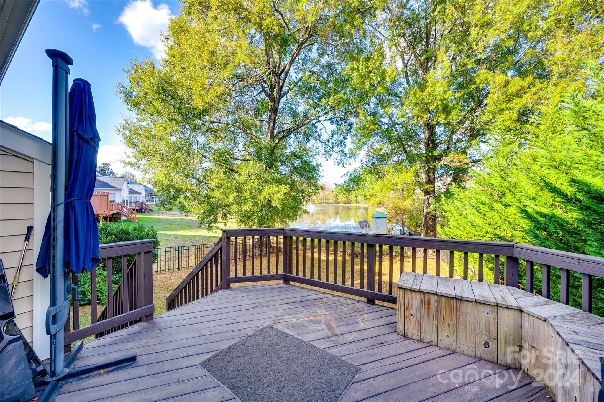 11417 Winget Pond Road Charlotte, NC 28278 - Photo 32 of 39 a balcony with wooden floor and outdoor space
