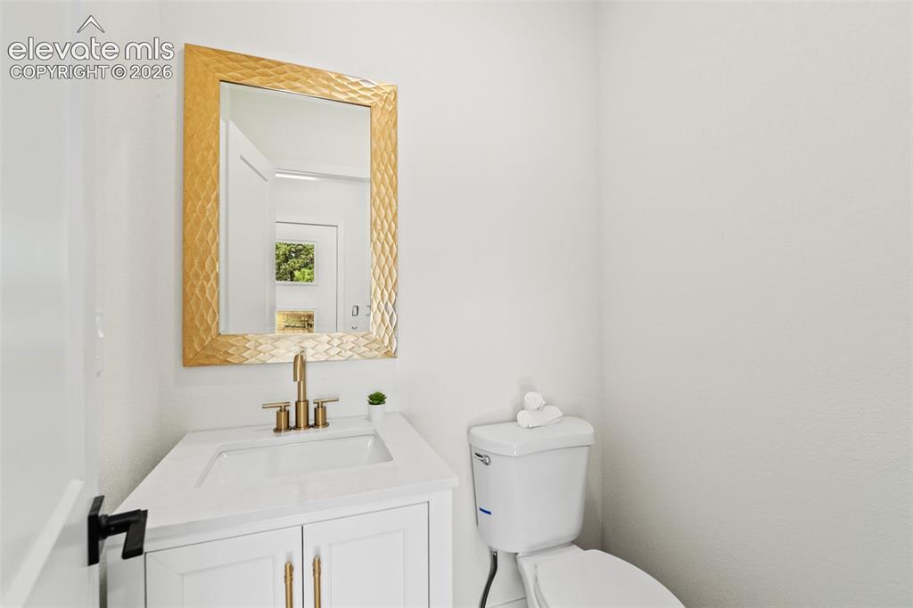 11665 Greentree Road Colorado Springs, CO 80908 - Photo 17 of 43 Bathroom featuring vanity and toilet