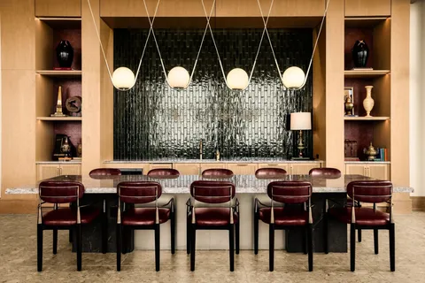 a dining area with furniture and window