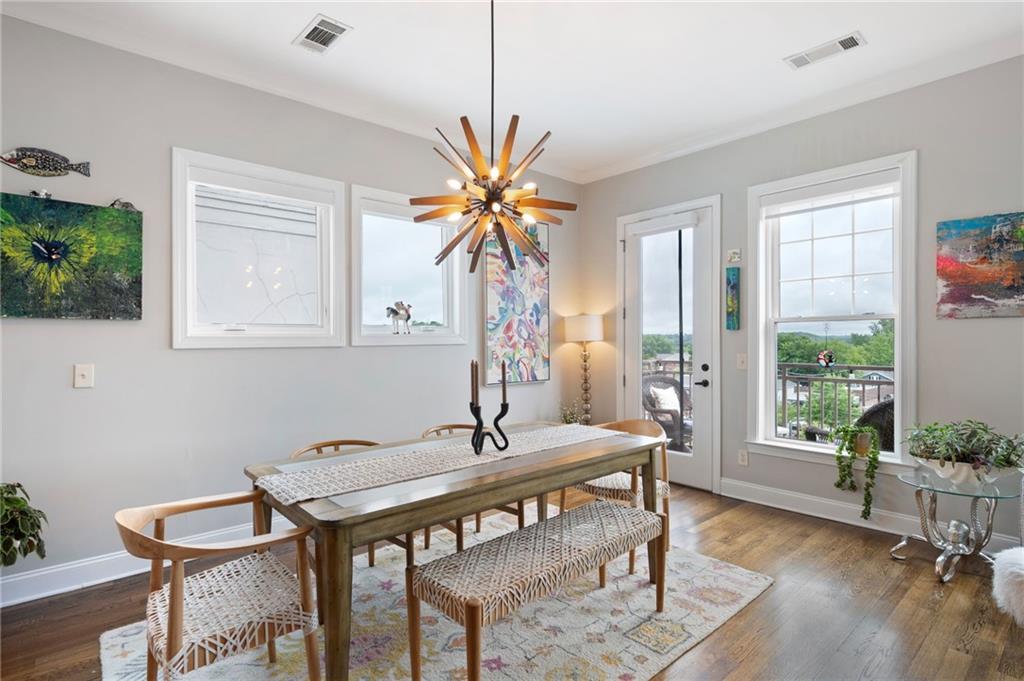 360 Chambers Street, Unit 407 Woodstock, GA 30188 - Photo 11 of 62 a dining room with furniture and window