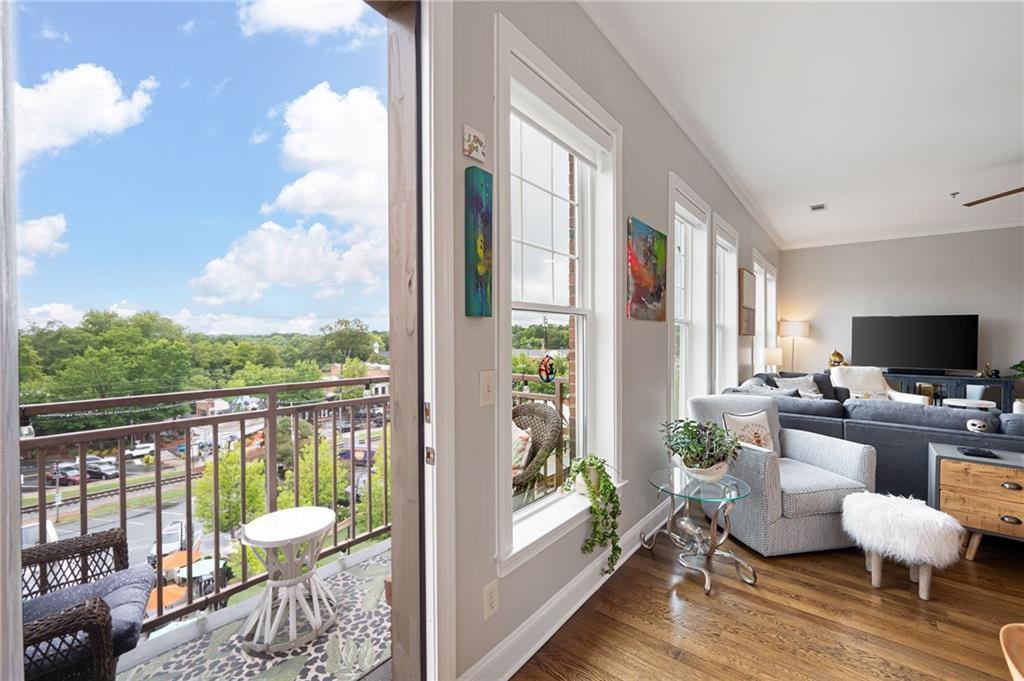 360 Chambers Street, Unit 407 Woodstock, GA 30188 - Photo 13 of 62 a living room with furniture fireplace and a large window