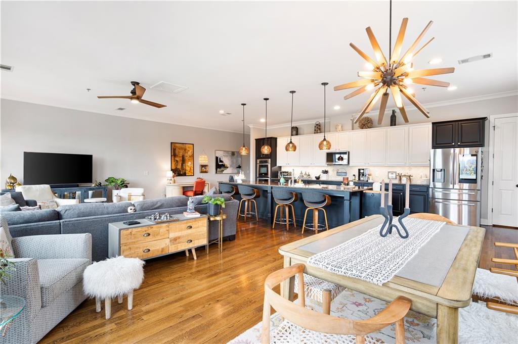 360 Chambers Street, Unit 407 Woodstock, GA 30188 - Photo 18 of 62 a living room with lots of furniture dining table and a table
