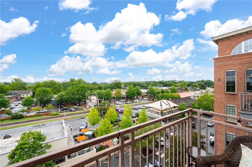360 Chambers Street, Unit 407 Woodstock, GA 30188 - Photo 19 of 62 a view of a city from a balcony