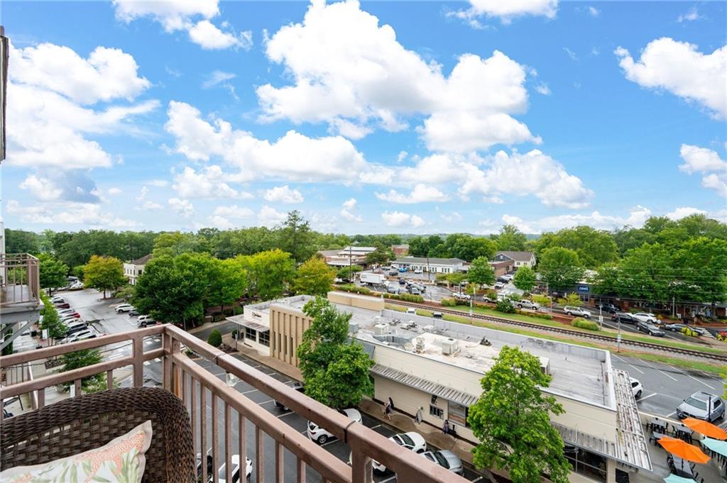360 Chambers Street, Unit 407 Woodstock, GA 30188 - Photo 20 of 62 a view of a city from a balcony