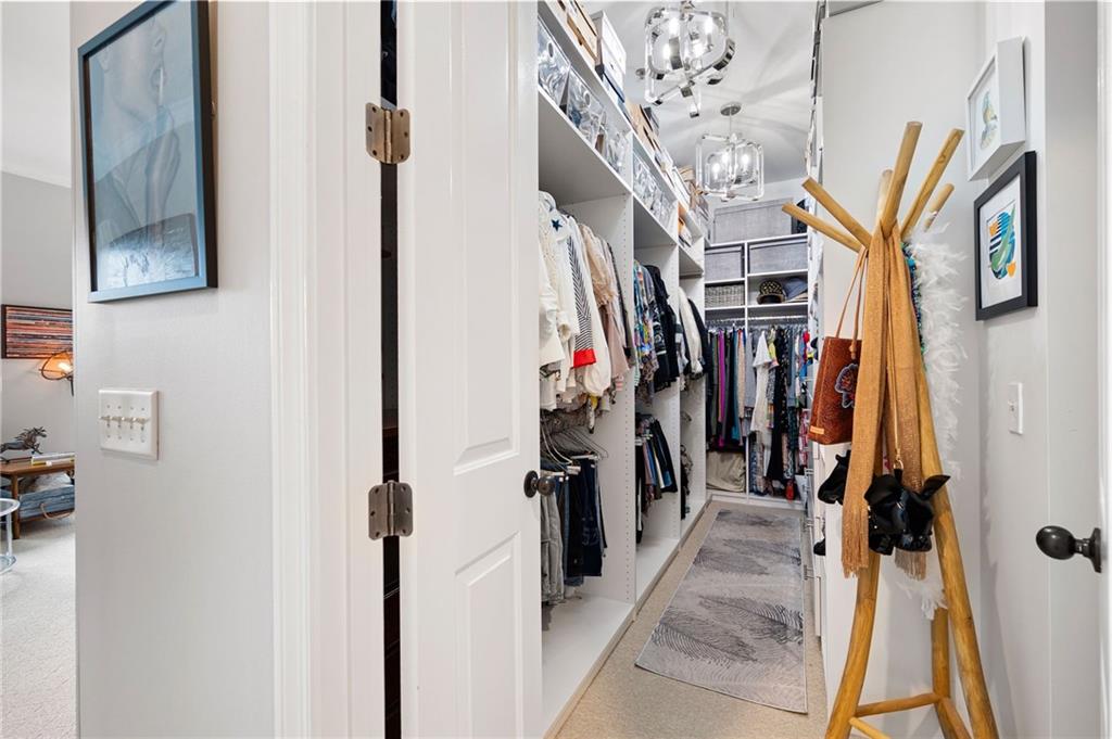 360 Chambers Street, Unit 407 Woodstock, GA 30188 - Photo 37 of 62 a view of a hallway with a couch