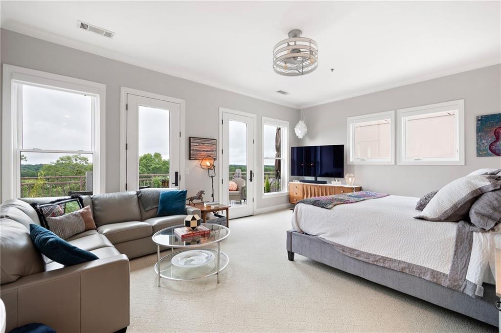 360 Chambers Street, Unit 407 Woodstock, GA 30188 - Photo 39 of 62 a living room with furniture and a flat screen tv