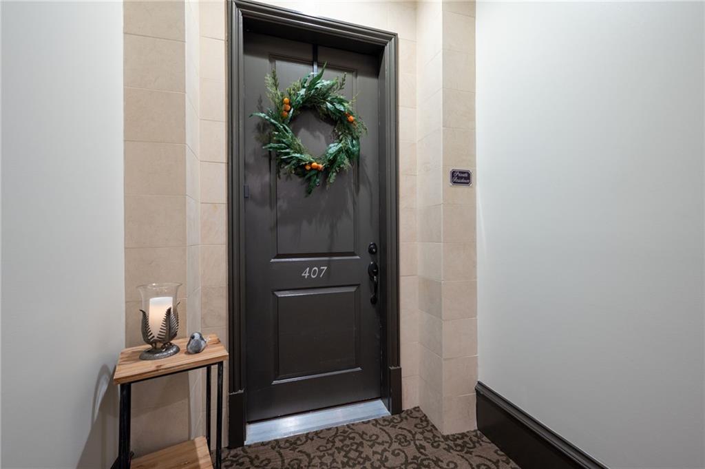 360 Chambers Street, Unit 407 Woodstock, GA 30188 - Photo 49 of 62 a view of hallway with wooden floor