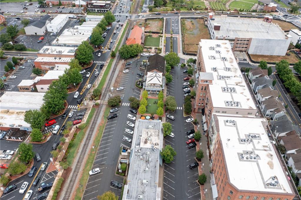 360 Chambers Street, Unit 407 Woodstock, GA 30188 - Photo 57 of 62 an aerial view of residential houses with outdoor space