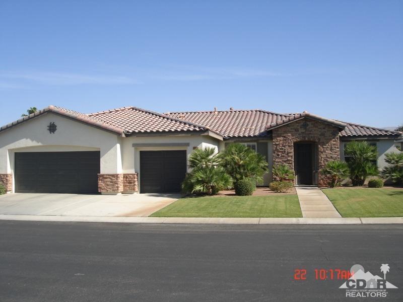 a front view of a house with a garage