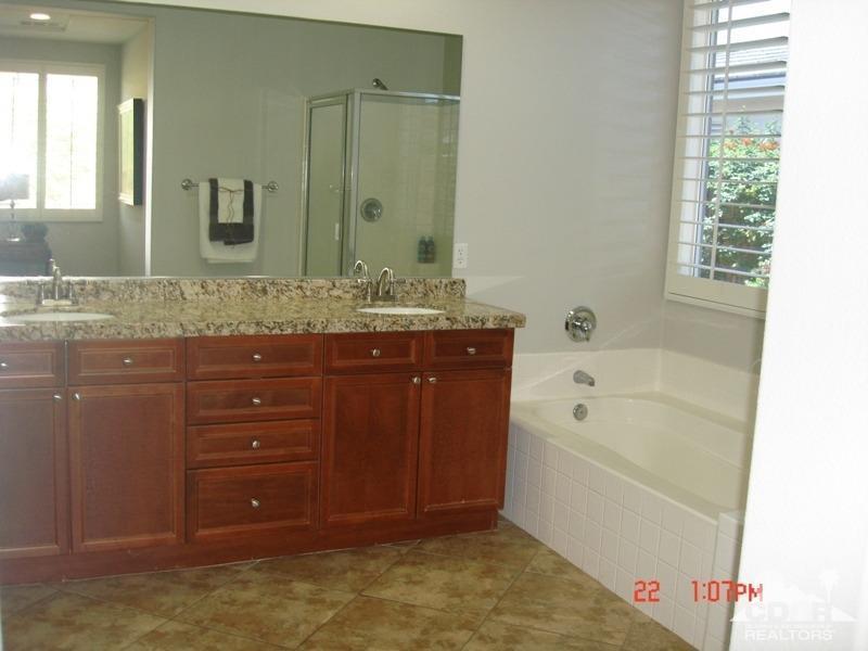 83436 Lightning Road Indio, CA 92203 - Photo 14 of 23 a bathroom with a tub sink and mirror