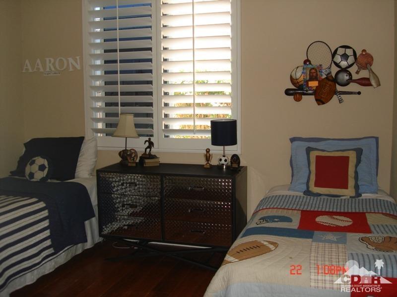 83436 Lightning Road Indio, CA 92203 - Photo 15 of 23 a bedroom with a bed and window