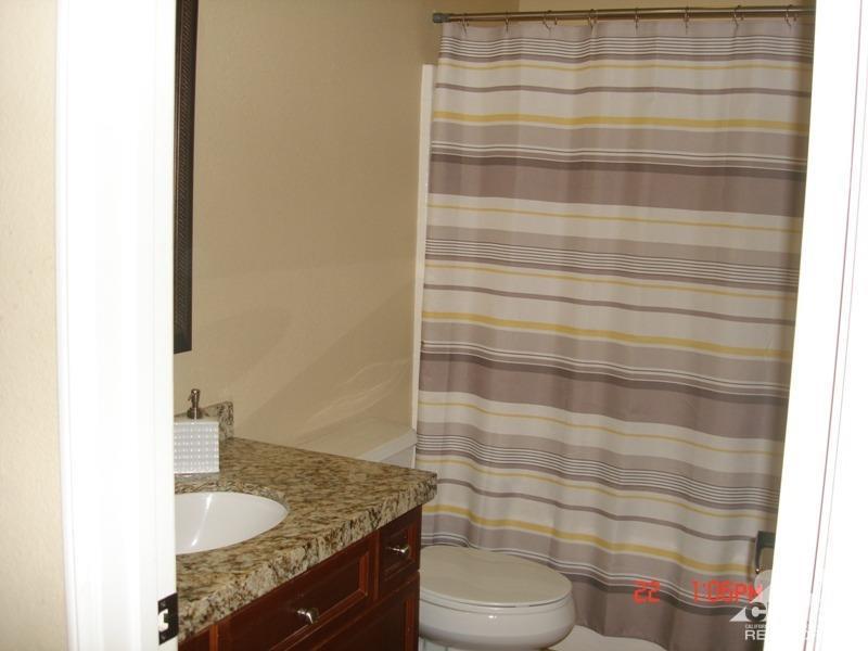 83436 Lightning Road Indio, CA 92203 - Photo 16 of 23 a bathroom with a granite countertop sink and a toilet